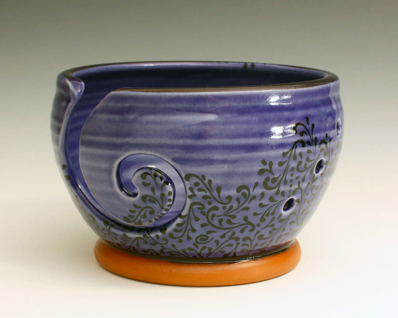 Ceramic yarn bowl. Glaze in a cobalt blue glaze with black swirl decoration.