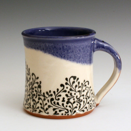 Blue and white hand made mug with hand decorated fine line black decoration.  Handmade with red earthenware clay and food safe glazes. 