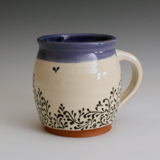 Blue and white hand made mug with hand decorated fine line black decoration. Handmade with red earthenware clay and food safe glazes. 